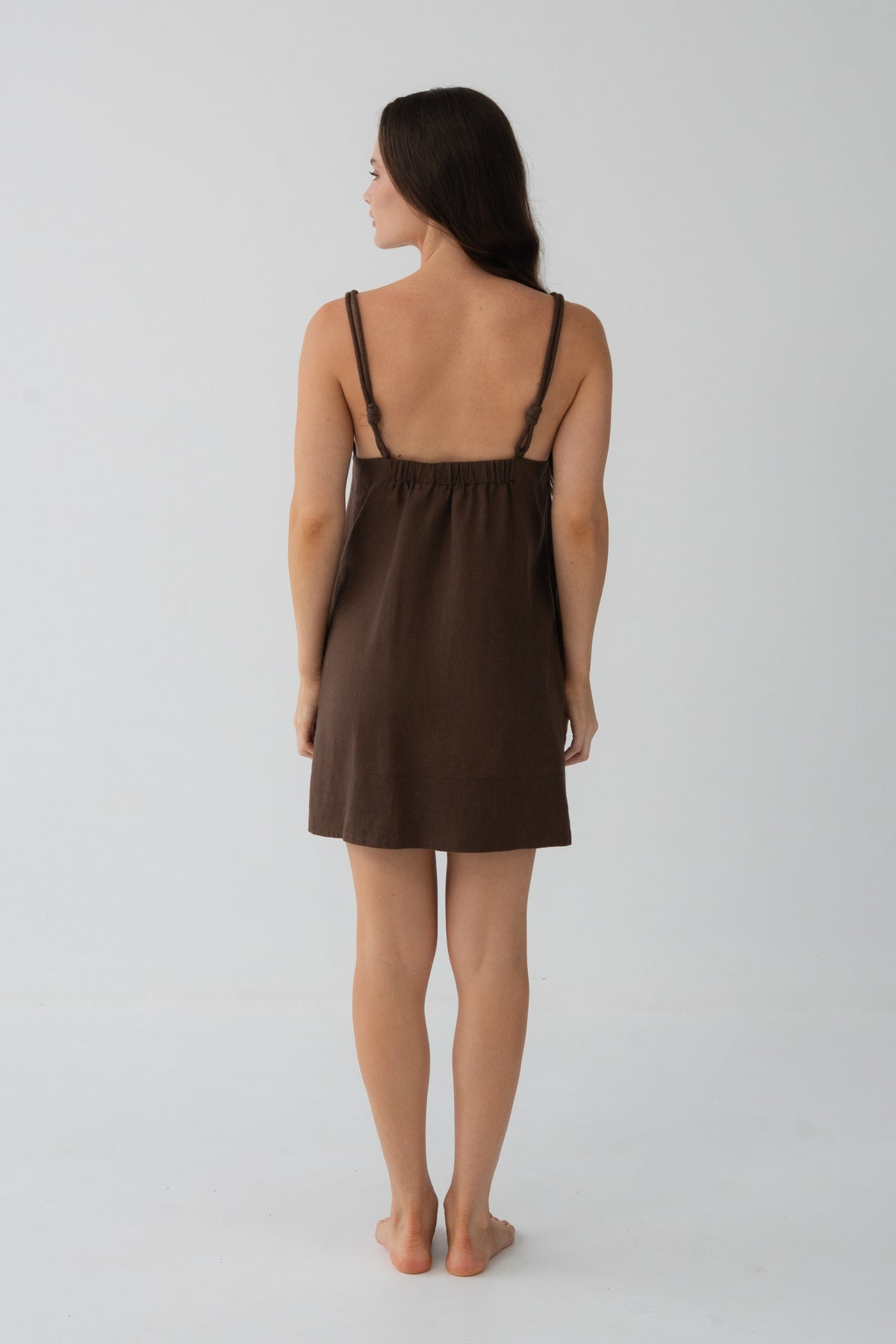 Tevi Linen Short Slip Dress in Chocolate - back view, gathered yoke and braided straps - Lilly Pilly Collection

