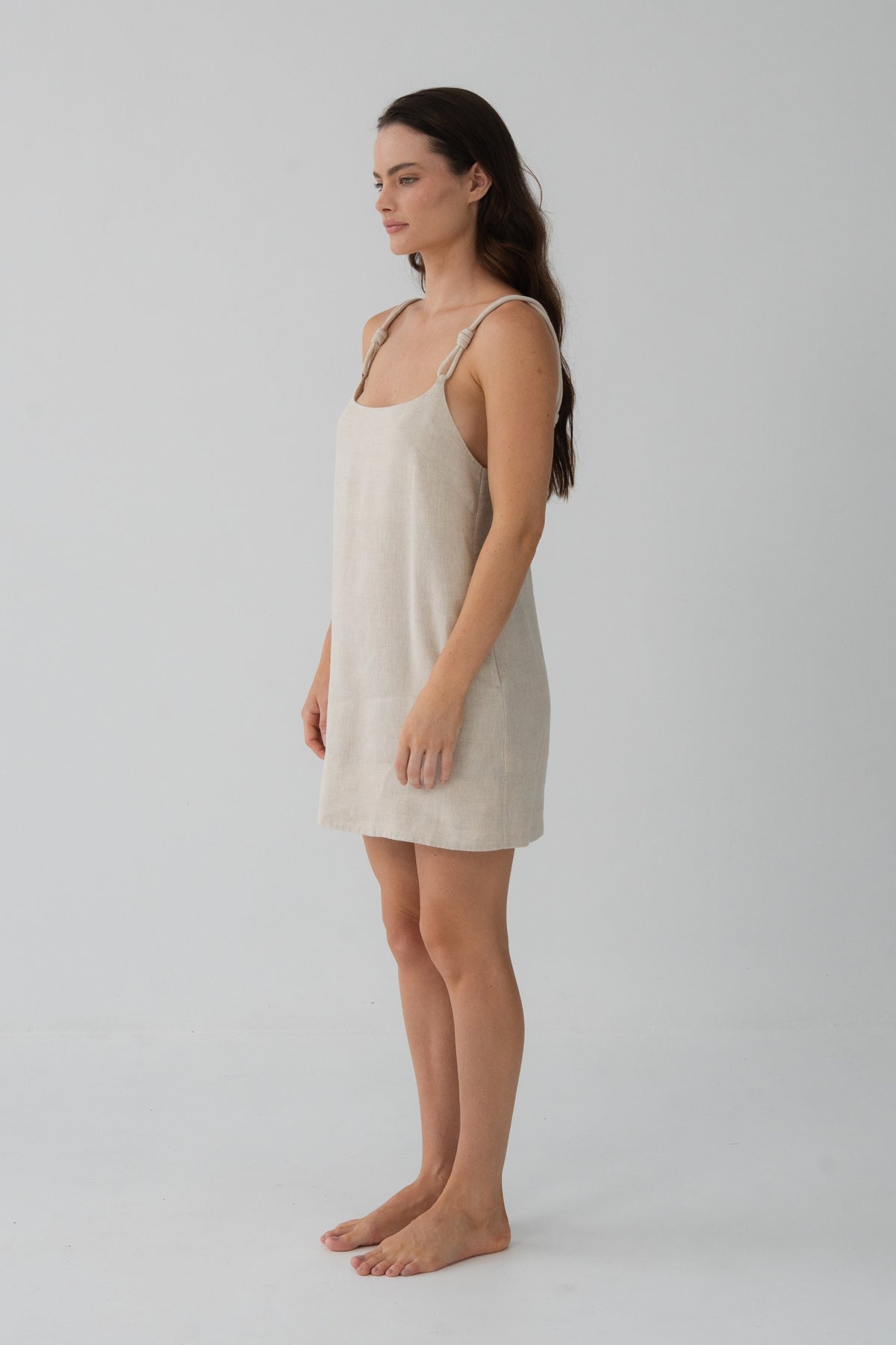 Tevi Linen Short Slip Dress in Oatmeal - side profile, braided straps and short linen drape - Lilly Pilly Collection