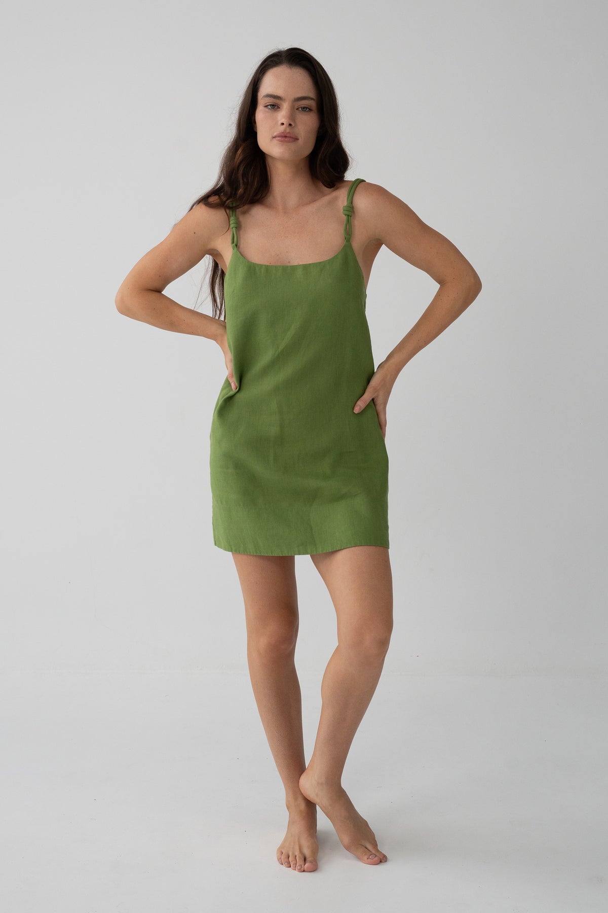 Tevi Linen Short Slip Dress in Lime Green - woman hands on hips, scoop neckline, white background - Lilly Pilly Collection