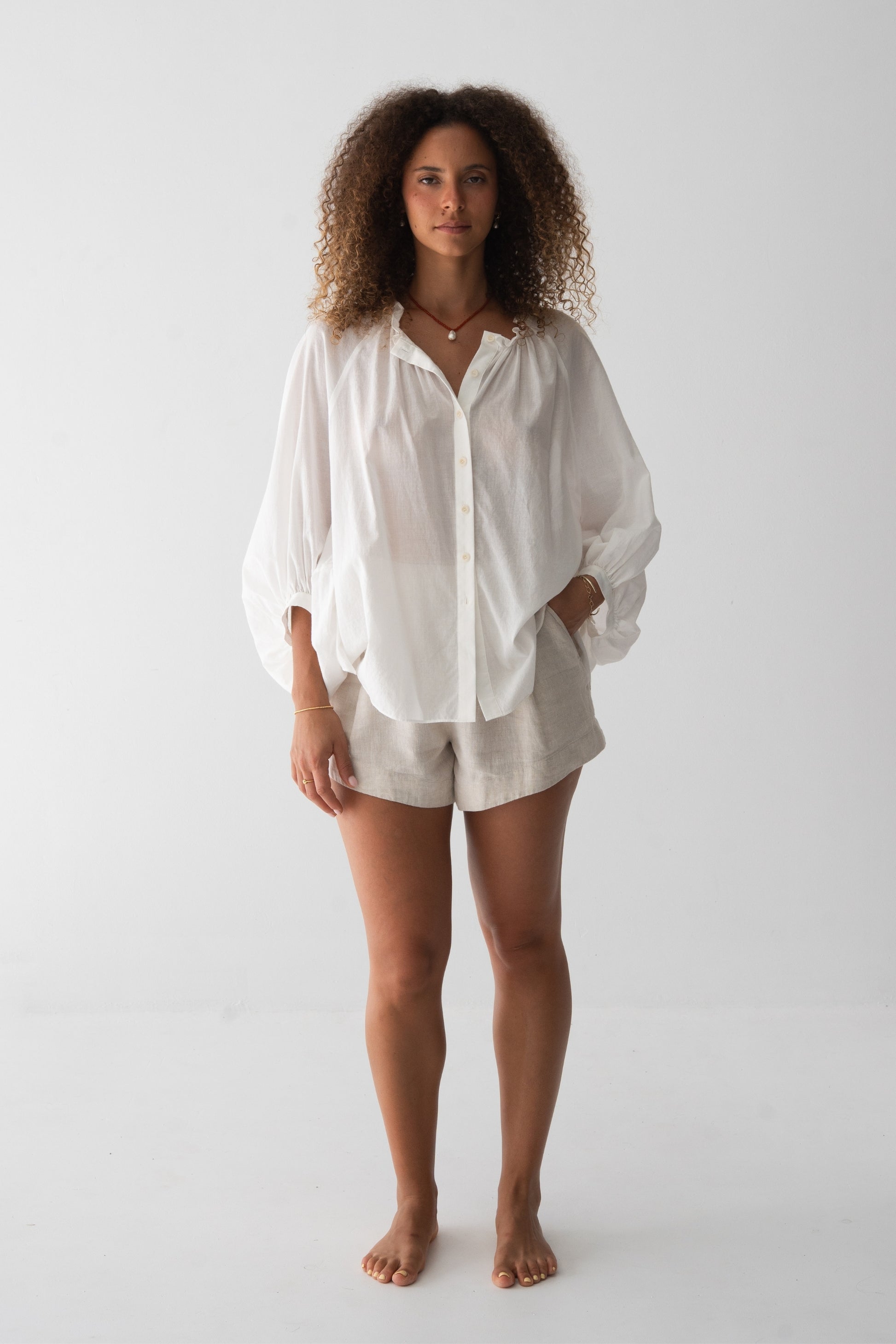 Thalia Cotton Voile Shirt in Ivory - front view, gathered neckline and button-front, balloon sleeves - Lilly Pilly Collection