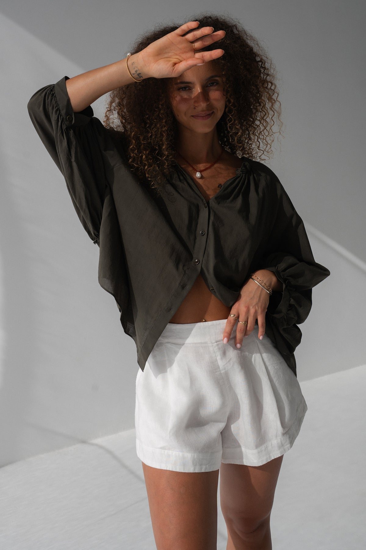 Thalia Cotton Voile Shirt in Khaki - close-up, gathered ruffle neckline and button-front detail - Lilly Pilly Collection