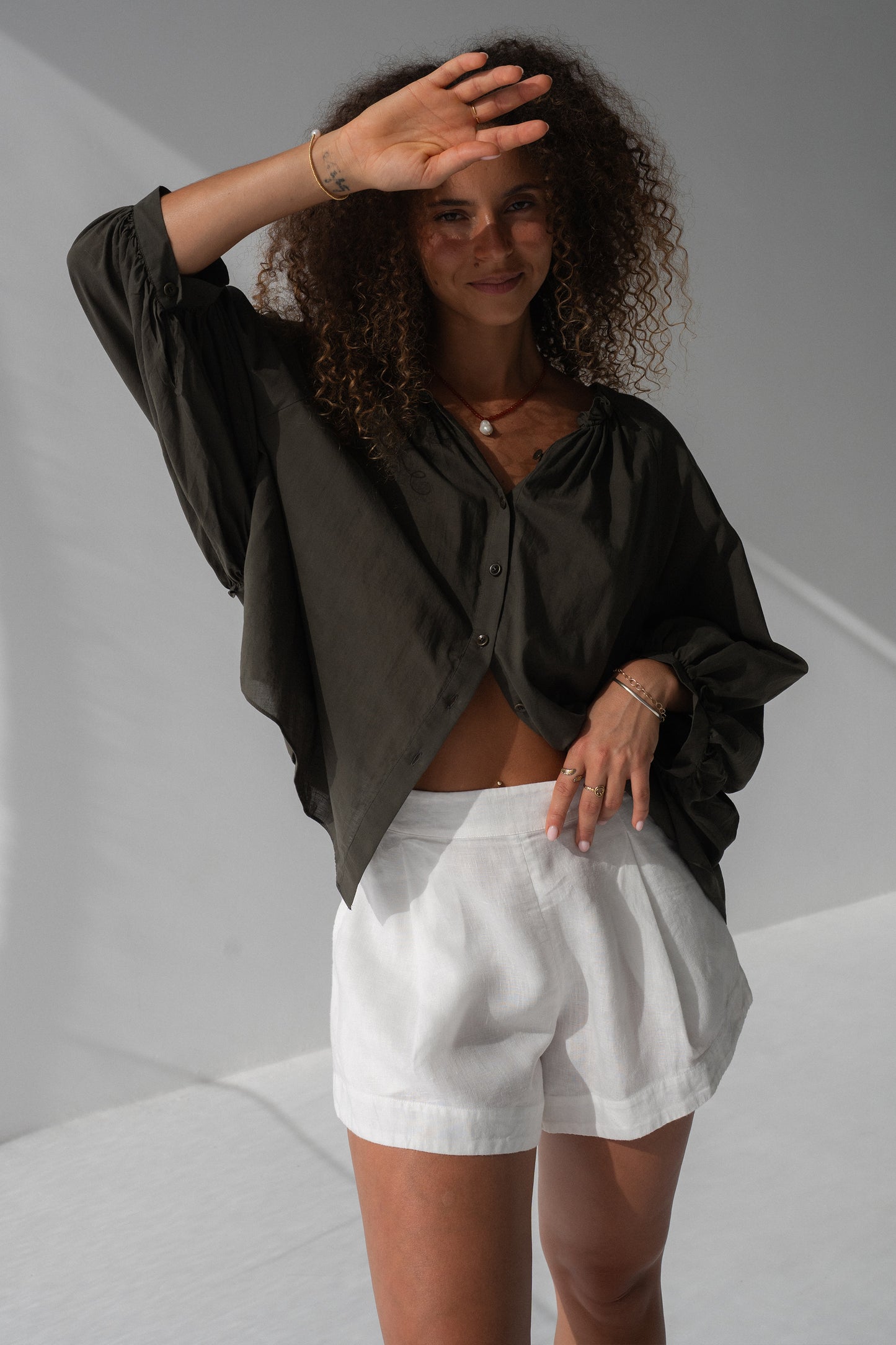 Thalia Cotton Voile Shirt in Khaki - close-up, gathered ruffle neckline and button-front detail - Lilly Pilly Collection