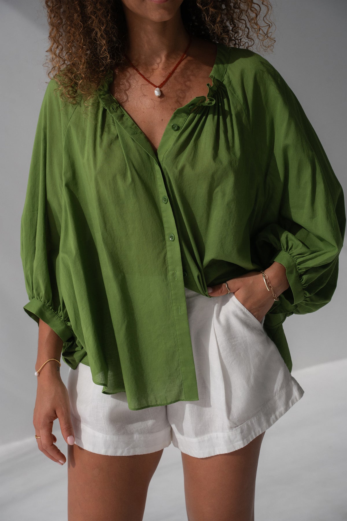 Thalia Cotton Voile Shirt in Lime Green - front view, gathered neckline and button-front, balloon sleeves, worn open as beach cover-up - Lilly Pilly Collection