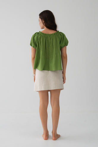 Tilly Cotton Voile Shirt in Lime Green - back view, gathered ruffle neckline and pintuck detail, puff sleeves, worn with Anelle Linen Mini Skirt in Oatmeal - Lilly Pilly Collection