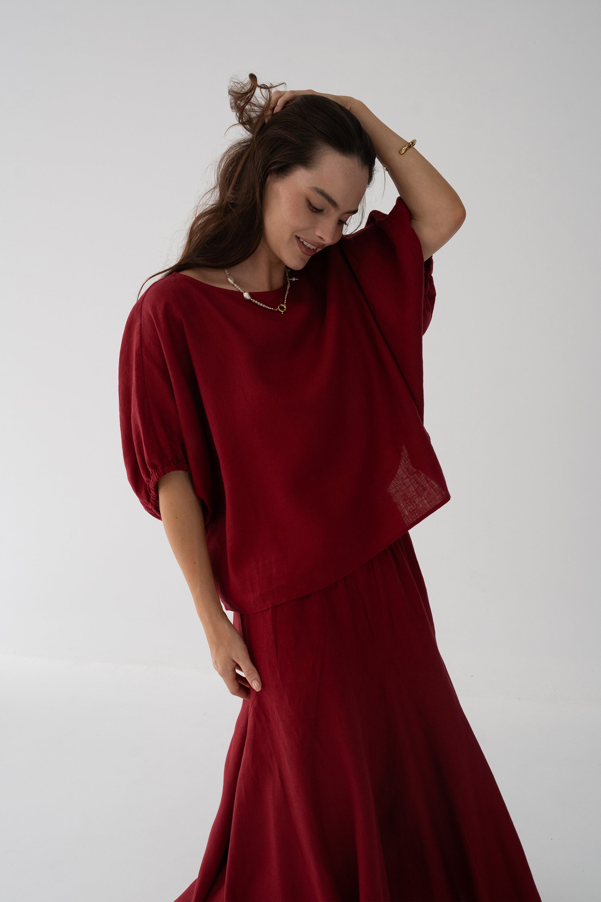 Tina Linen Top in Cherry Red - side profile, oversized batwing silhouette, styled with matching Riley Linen maxi skirt - Lilly Pilly Collection
