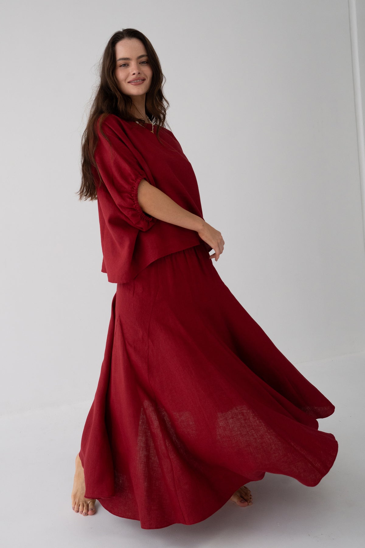 Tina Linen Top in Cherry Red - three-quarter view, oversized batwing silhouette and round neckline, styled with matching Riley Linen maxi skirt - Lilly Pilly Collection