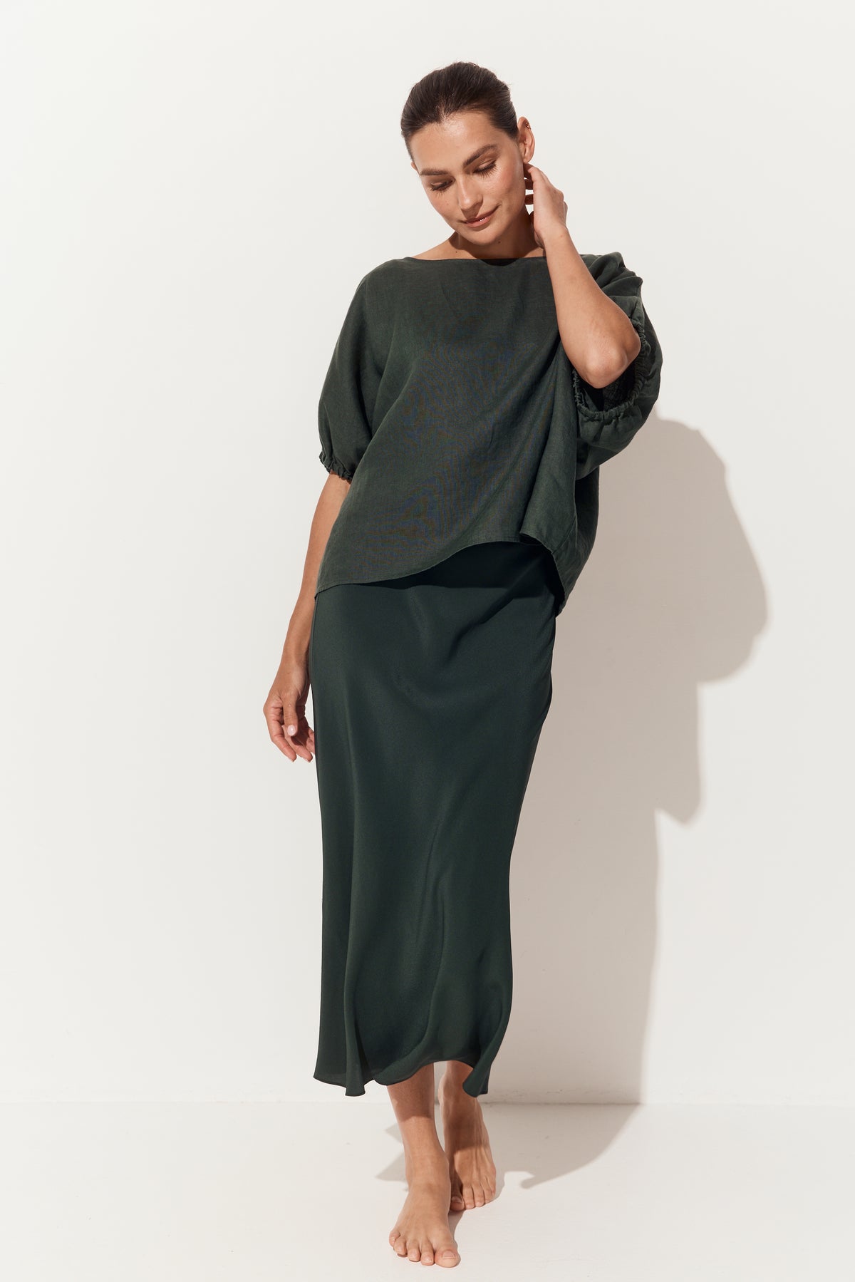 Tina Linen Top in Forest Green - front view with matching Freya silk slip walking pose - Lilly Pilly Collection