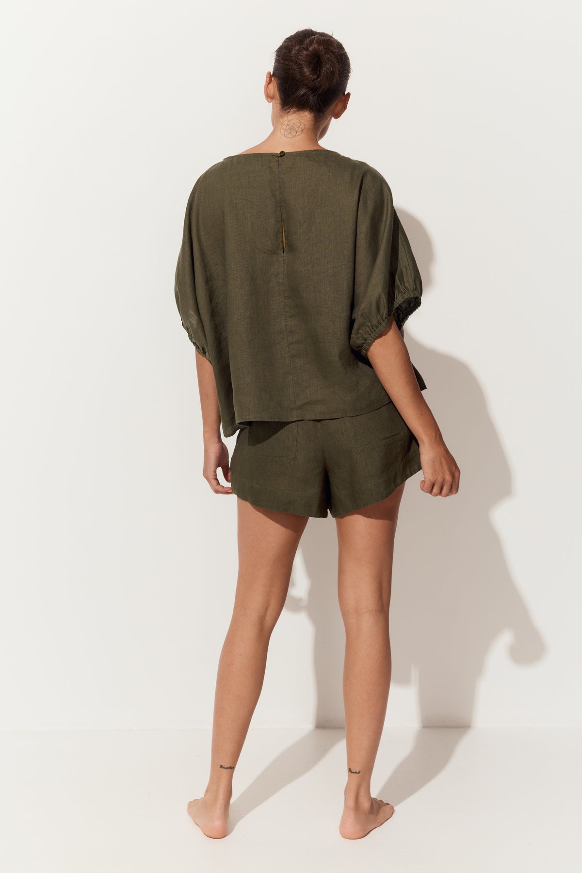 Tina Linen Top in Khaki - back view, round neckline and batwing sleeves with elasticated cuffs - Lilly Pilly Collection