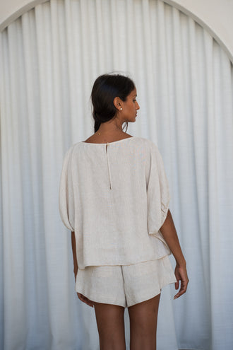 Tina Linen Top in Oatmeal - back view, batwing silhouette and back keyhole detail, styled with matching Gaia Linen shorts - Lilly Pilly Collection