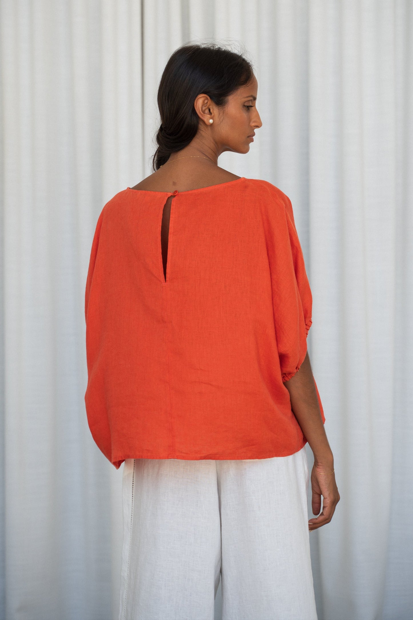 Person wearing a Leia linen top in Spritz back view