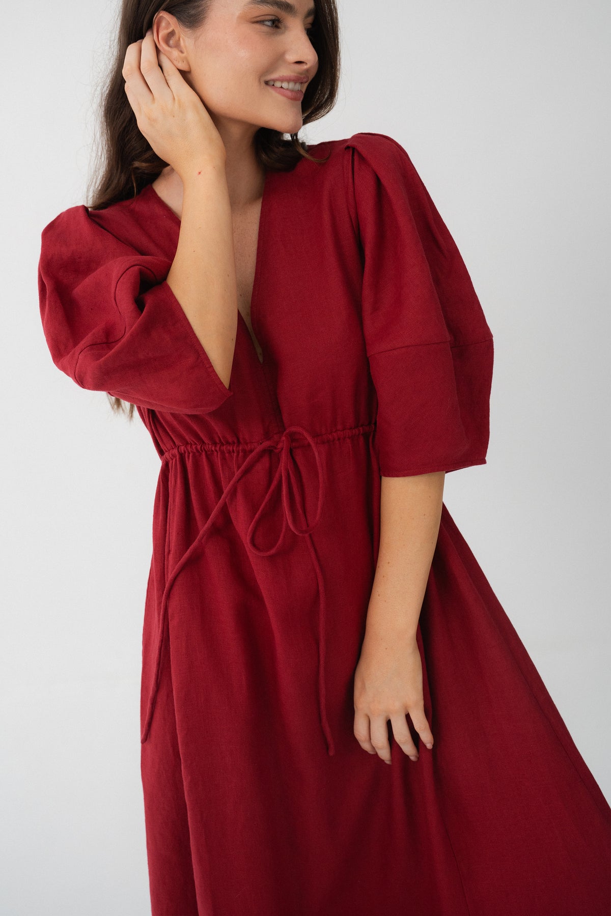 Front view of a woman wearing the Vida Linen maxi dress in Cherry Red in a studio - Lilly Pilly Collection