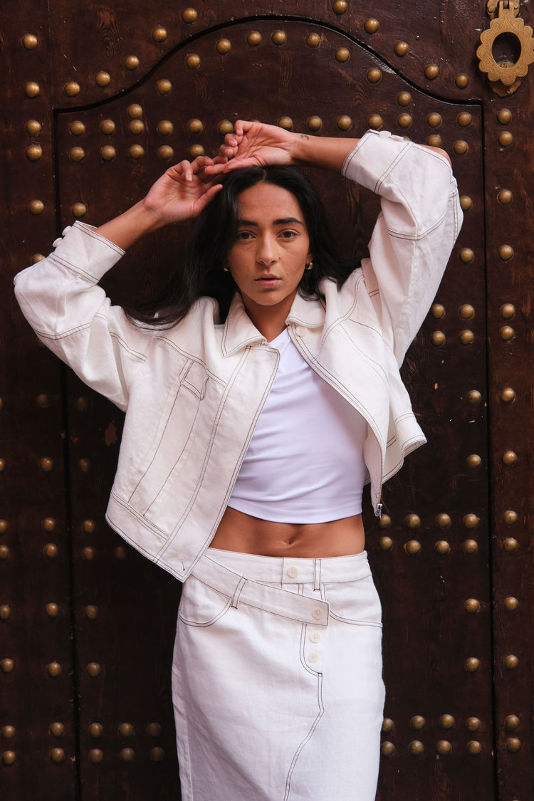 Wes Linen Jacket in Ivory - front view, in front of a dark wooden door with gold accents - Lilly Pilly Collection