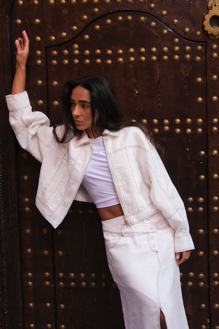 Wes Linen Jacket in Ivory - front view, standing in front of a large ornate door - Lilly Pilly Collection