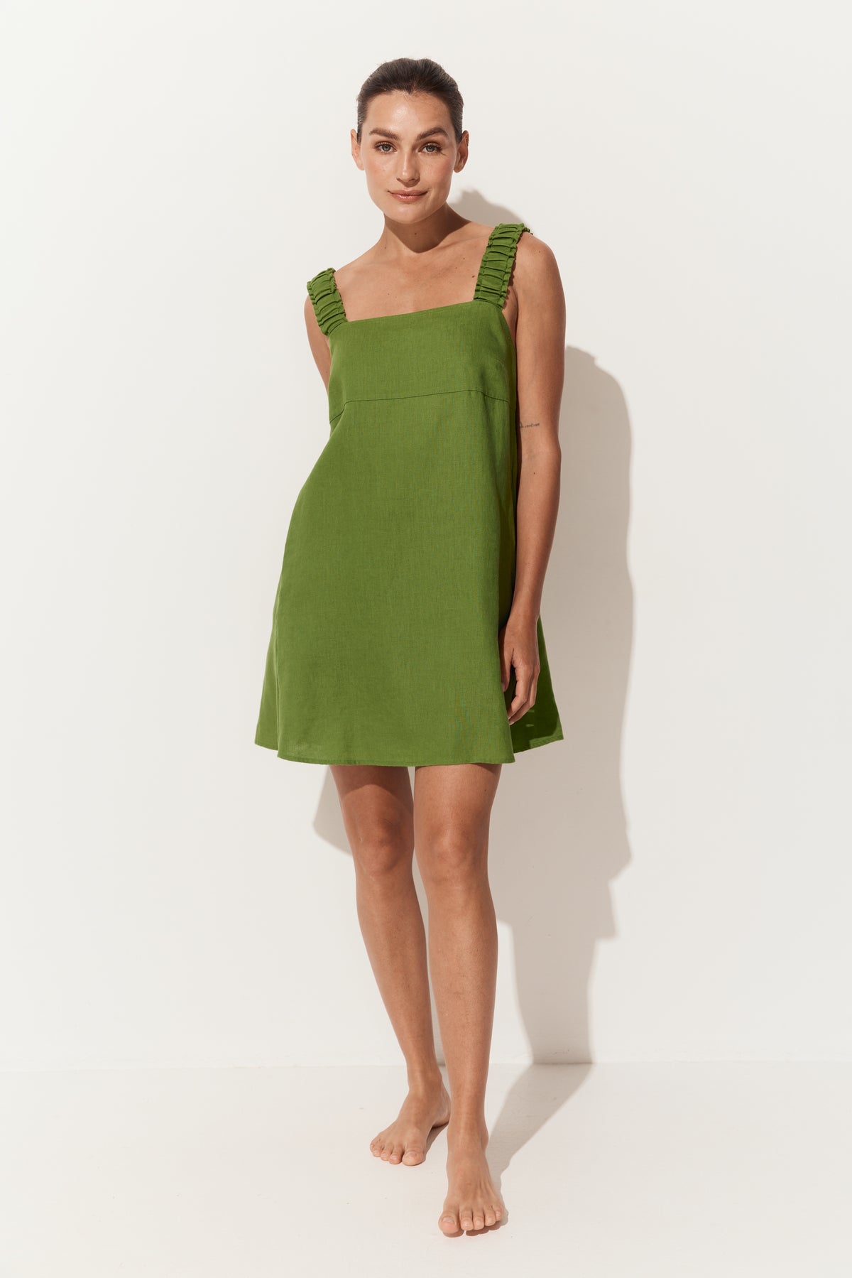 Zahra Linen Mini Dress in Lime Green - three quarter view with shoulder straps - Lilly Pilly Collection