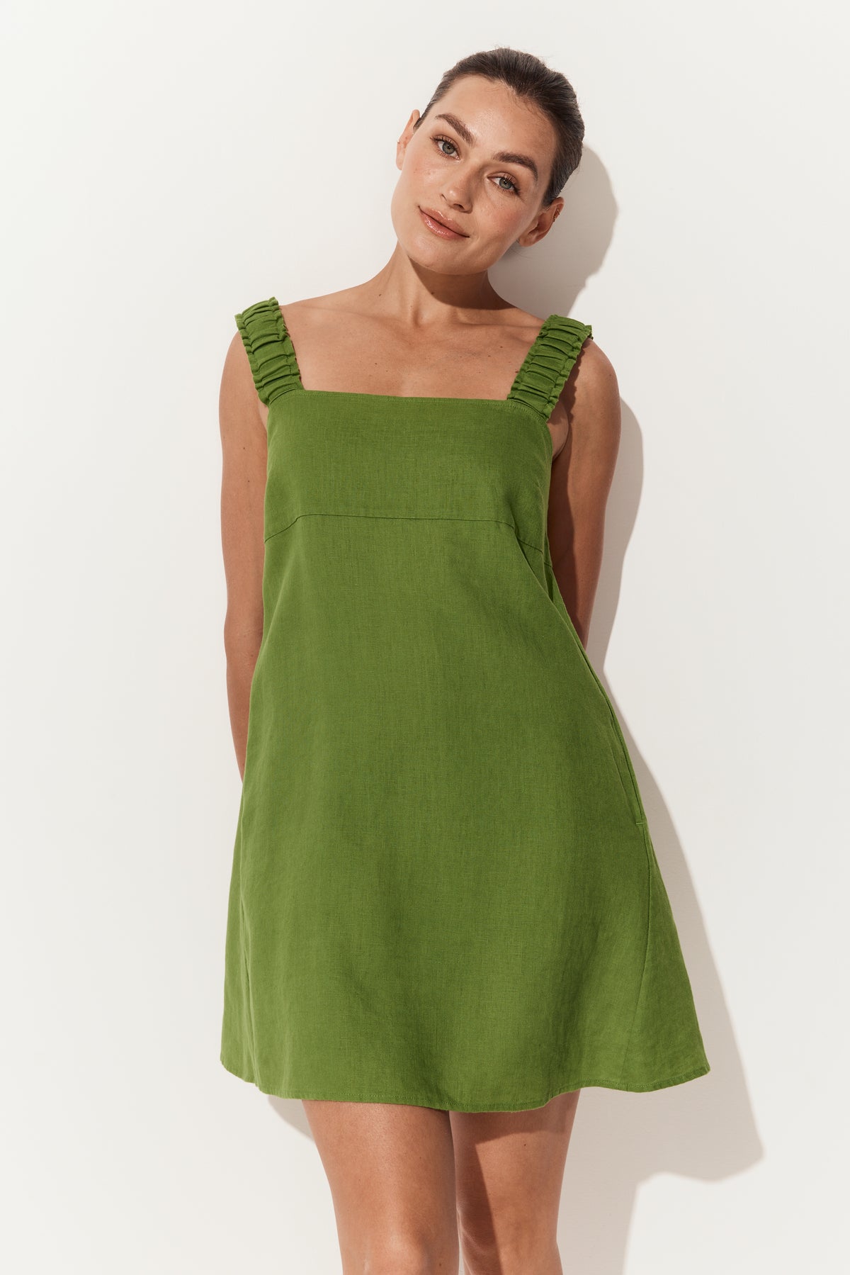 Zahra Linen Mini Dress in Lime Green - front view arms behind back - Lilly Pilly Collection